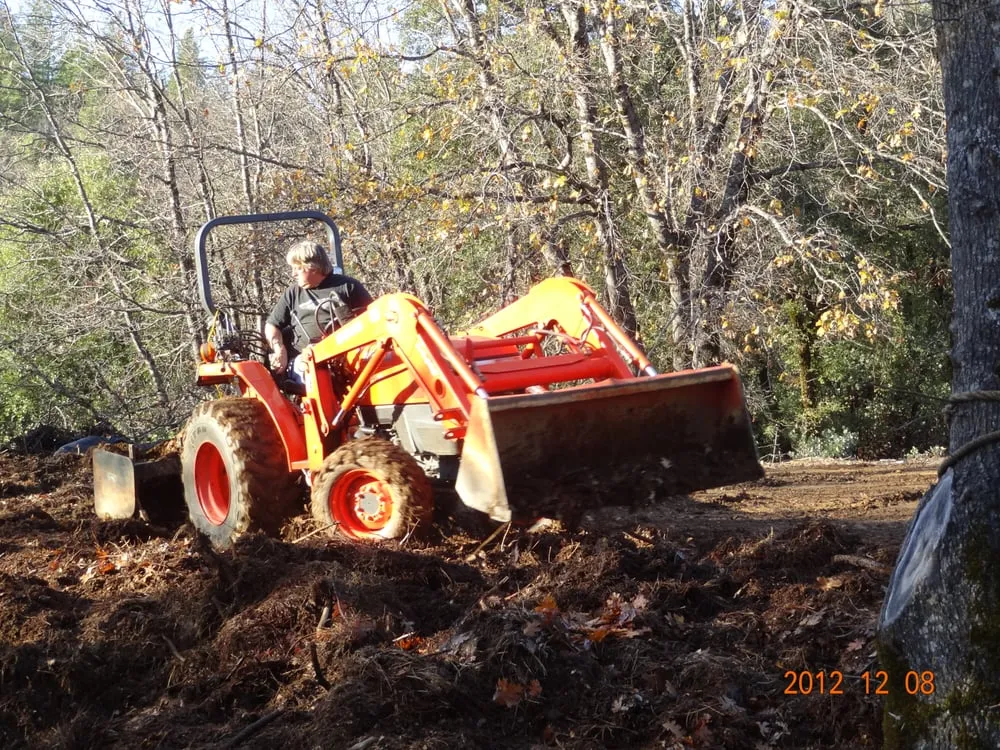 Yard maintenance with tractor